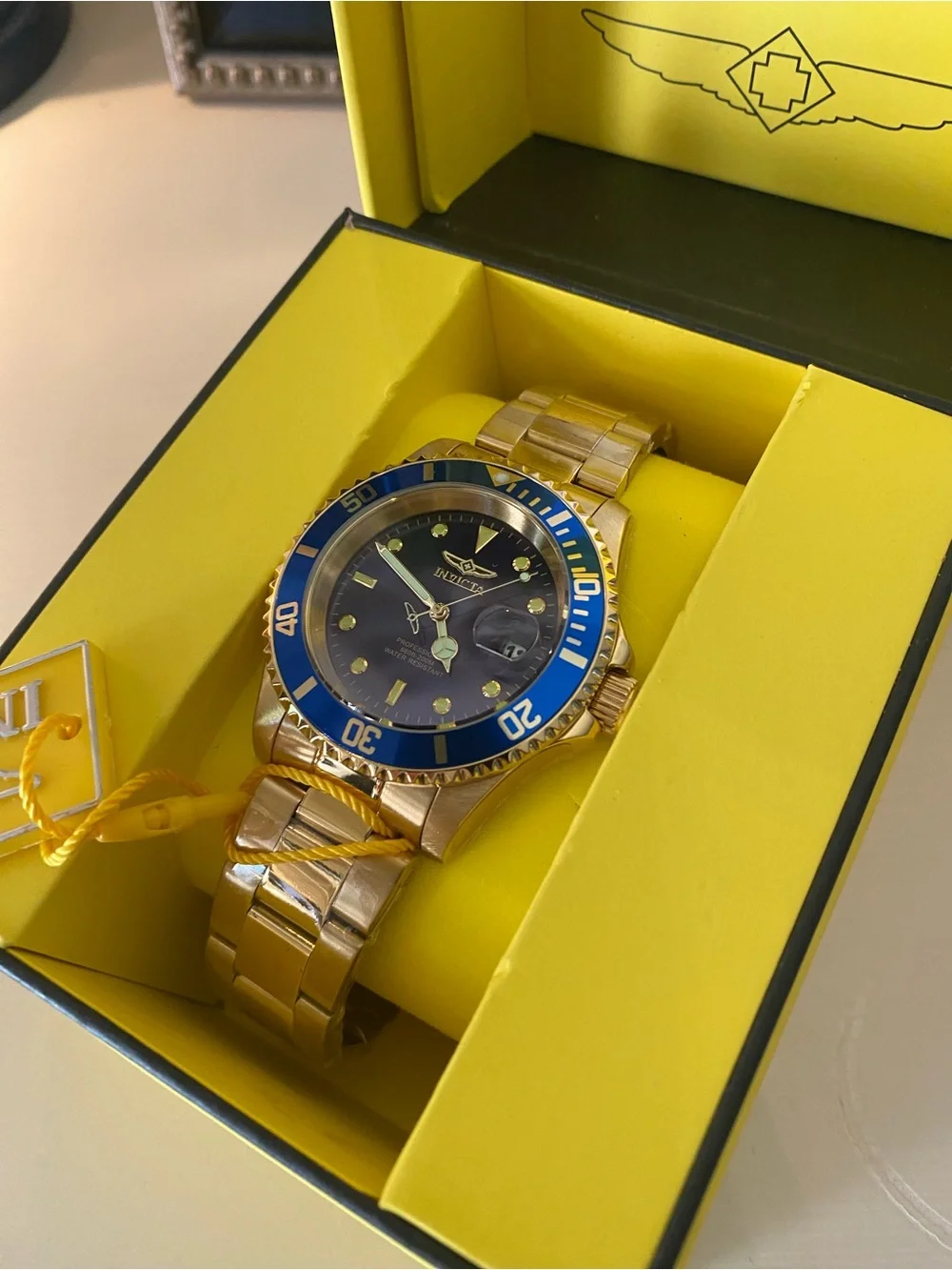 Invicta Gold Tone Watch with Blue Bezel and Dial